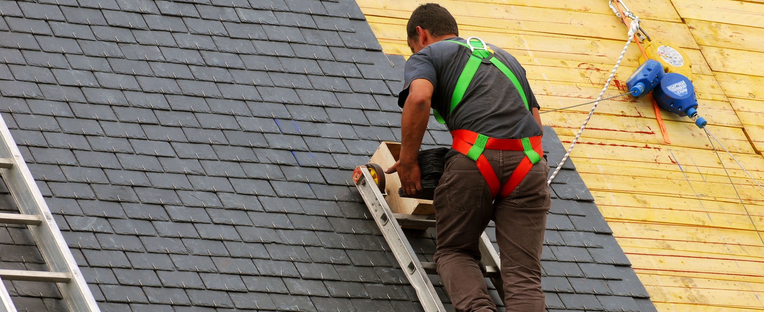 Roofer installing new roof