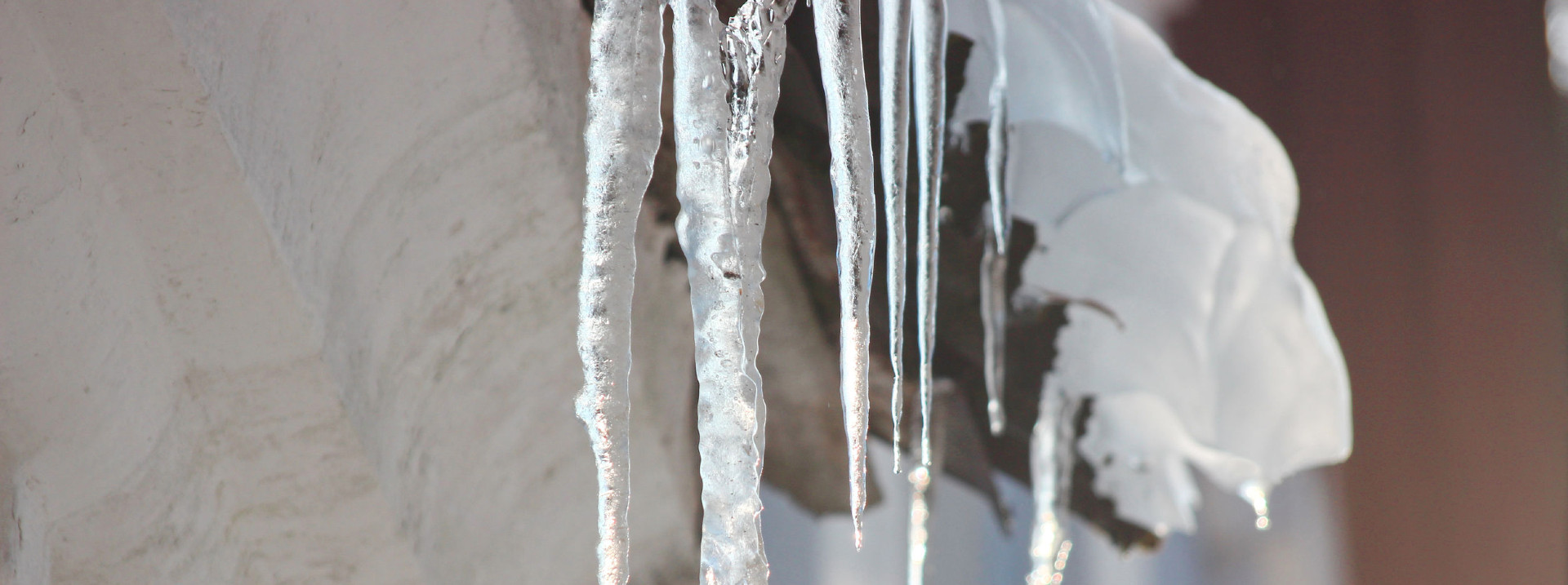 Icicles on a snow covered roof