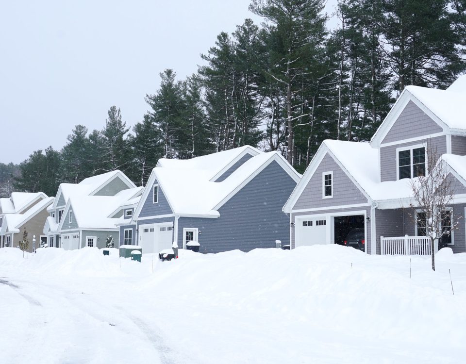 houses in residential community after snow in winter