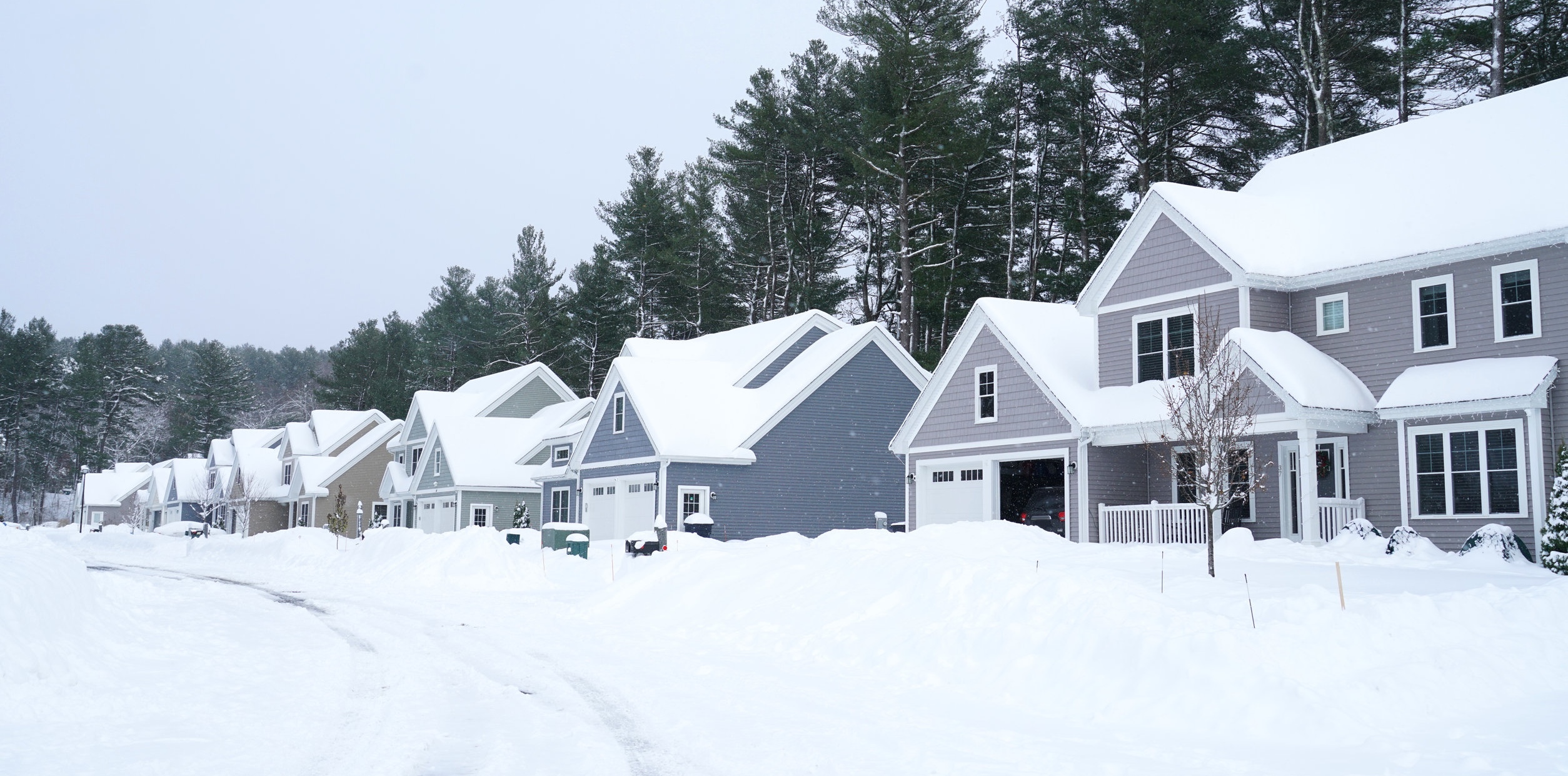 houses in residential community after snow in winter